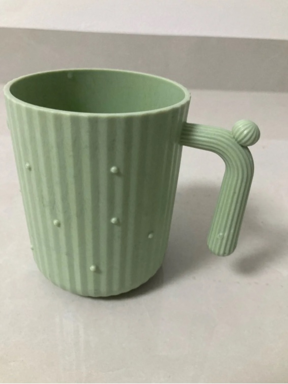 Mint Green Textured Ceramic Mug with Unique Handle